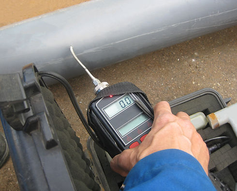 A professional detecting a gas leak