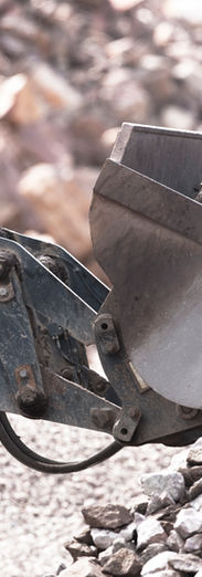 Close-up of digger scooping up aggregate