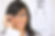 Young woman with glasses eye chart in background