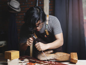 A man learning woodcarving.