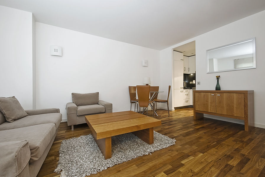 living room with wood floor (not Quick-Step)
