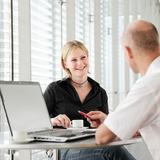 Two people having a little meeting in a bright room..