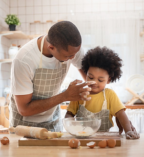 Father and child baking