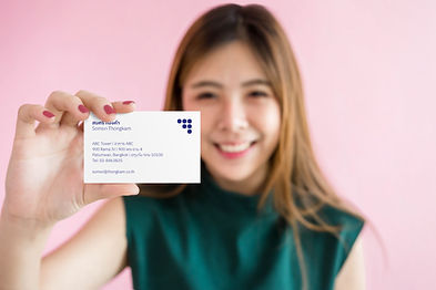 Woman holding business card