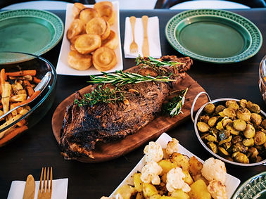 Family style roast beef with savory sides by C. Parks Catering and Events private chef dinner.