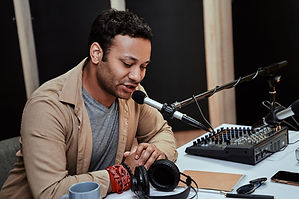 A young man in a recording studio