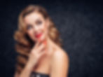 Stunning woman with red nails and red lipstick