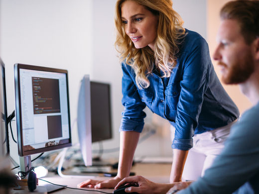 two people looking at monitor