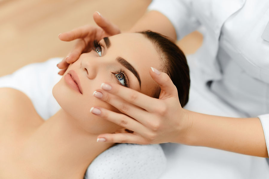 a woman receiving face massage
