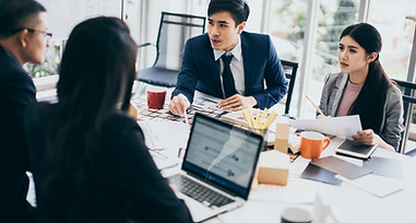Group of Asian businessmen discussing