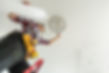 Handyman Installing Ceiling Light