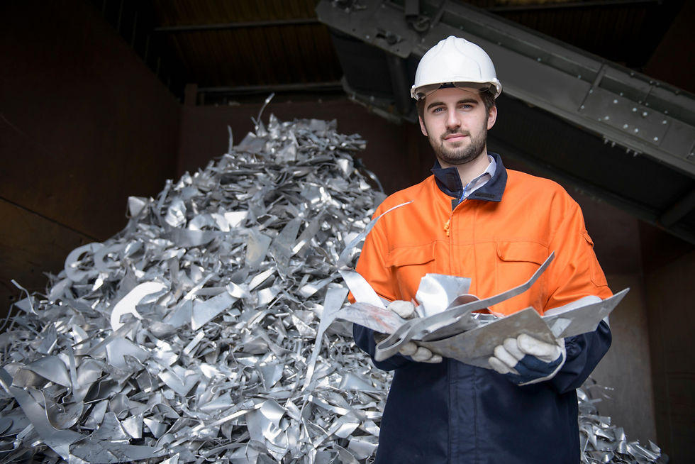 Portrait of worker holding scrap aluminum