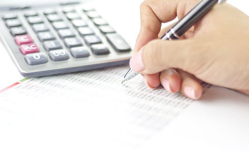 Businesswoman balancing the accounts