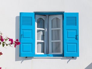 Open windows with blue shutters