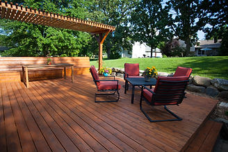 Backyard deck with pergola, a table and chairs