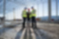 Architect and builders meeting on construction site