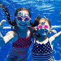 Girls Swimming Underwater