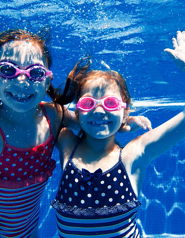 Girls Swimming Underwater