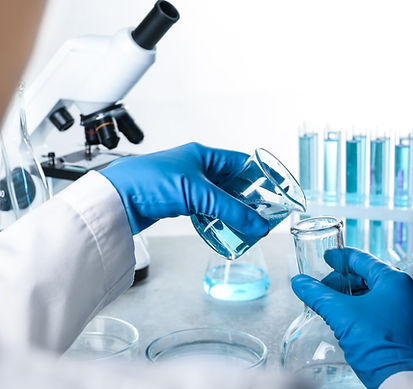 Scientist Mixing Chemicals