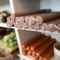 Long Candles on Shelf