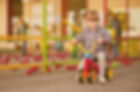 Girl Riding a Tricycle