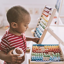 Boy Playing with Abacus