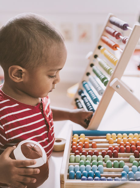 Boy Playing with Abacus