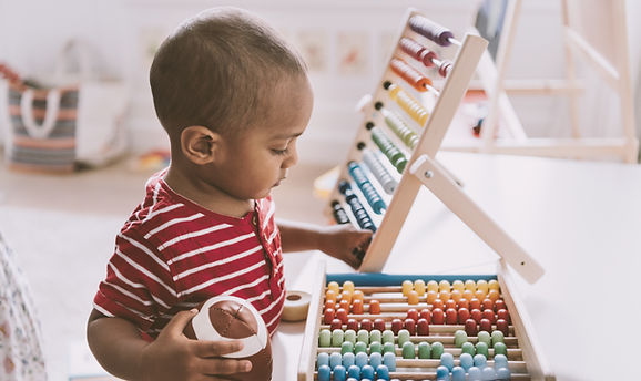 Boy Playing with Abacus