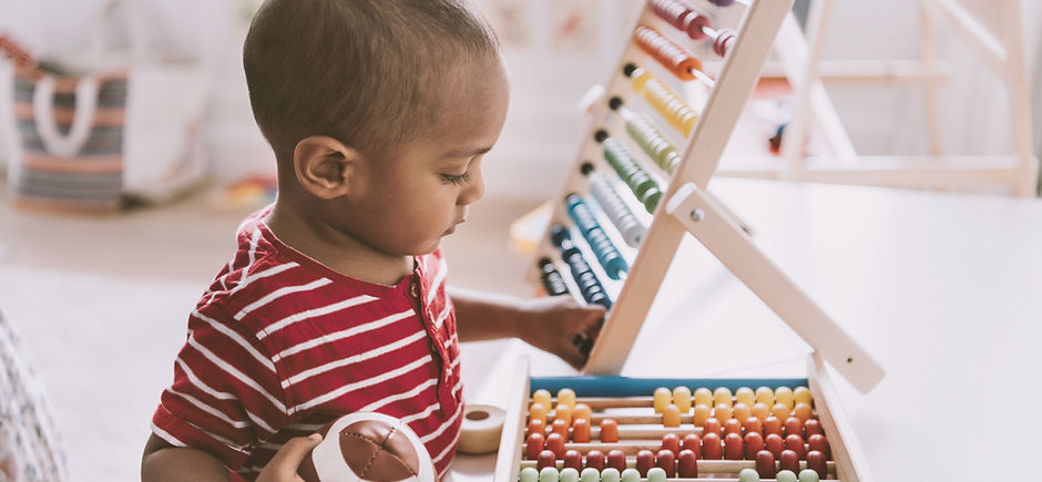 Boy Playing with Abacus