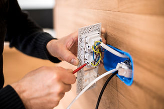 Close-up of a professional installing a new socket