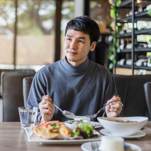 Person Eating at Restaurant