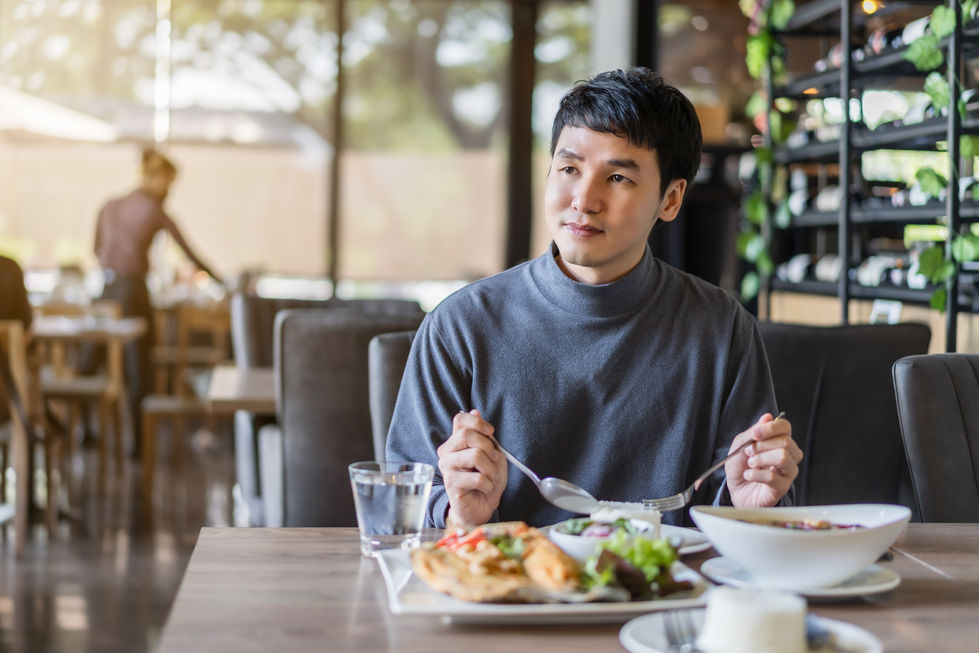 Person Eating at Restaurant