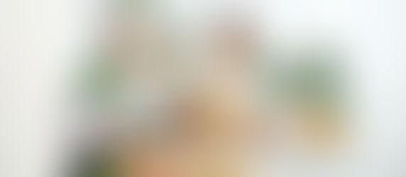 male food vlogger in kitchen with phone recording