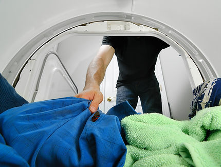View of a person loading the washing machine