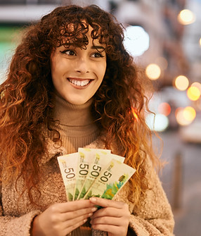 Smiling Woman Holding Money