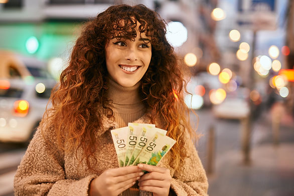Smiling Woman Holding Money