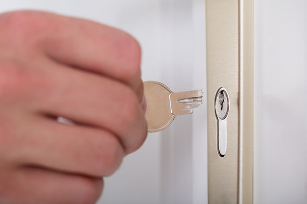 Close-up of a person's hand holding a broken Key