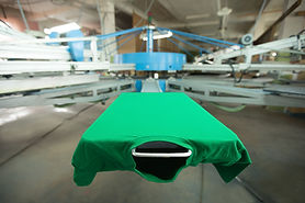 Green t-shirt on silk printing machine
