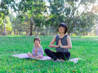 Mom and Daughter Meditating