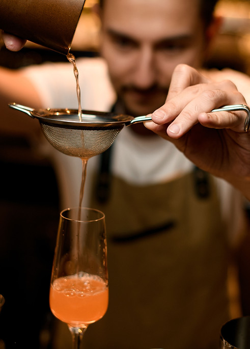 Mixologist Preparing a Drink