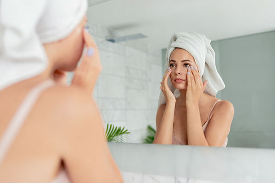 Woman Applying Eye Cream