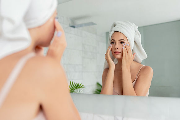Woman Applying Eye Cream