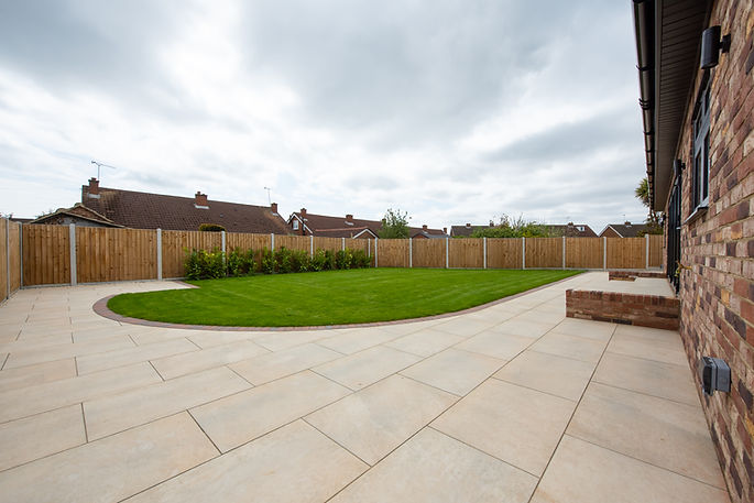 A newly laid back garden patio and lawn