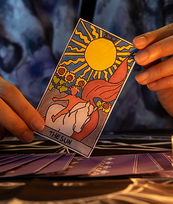 Tarot cards in the hands of a reader