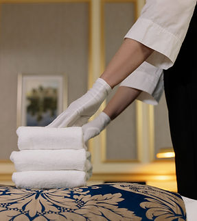 Housekeeper arranging towels