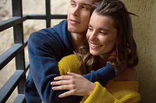 A couple in a relationship hugs