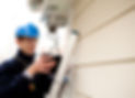 A professional setting up a security system