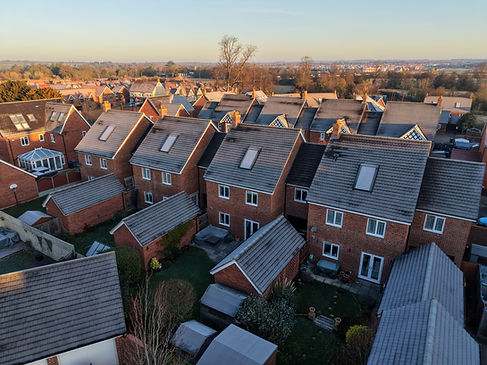 Aerial drone view of residential rooftops