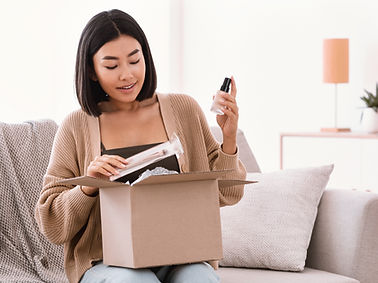 A woman openning a parcel
