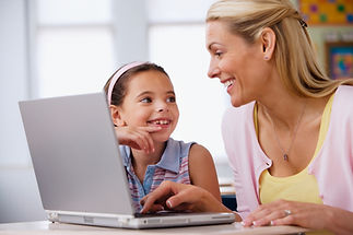 a lady and girl child with laptop